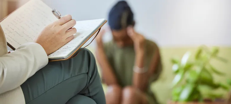 therapy-writing-psychologist-sad-black-woman-with-stress-headache-burnout-office-support-therapist-consultation-mental-health-check-with-psychology-work-patient-sofa