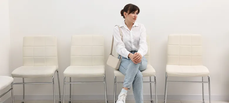woman-sitting-chair-waiting